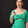 A fashionable woman wearing a trendy mini dress, perfect for casual or party wear.