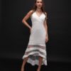 Woman wearing the Olia Midi Dress – a white sleeveless evening dress with a V-neckline and sheer striped high-low hem, ideal for elegant occasions.
